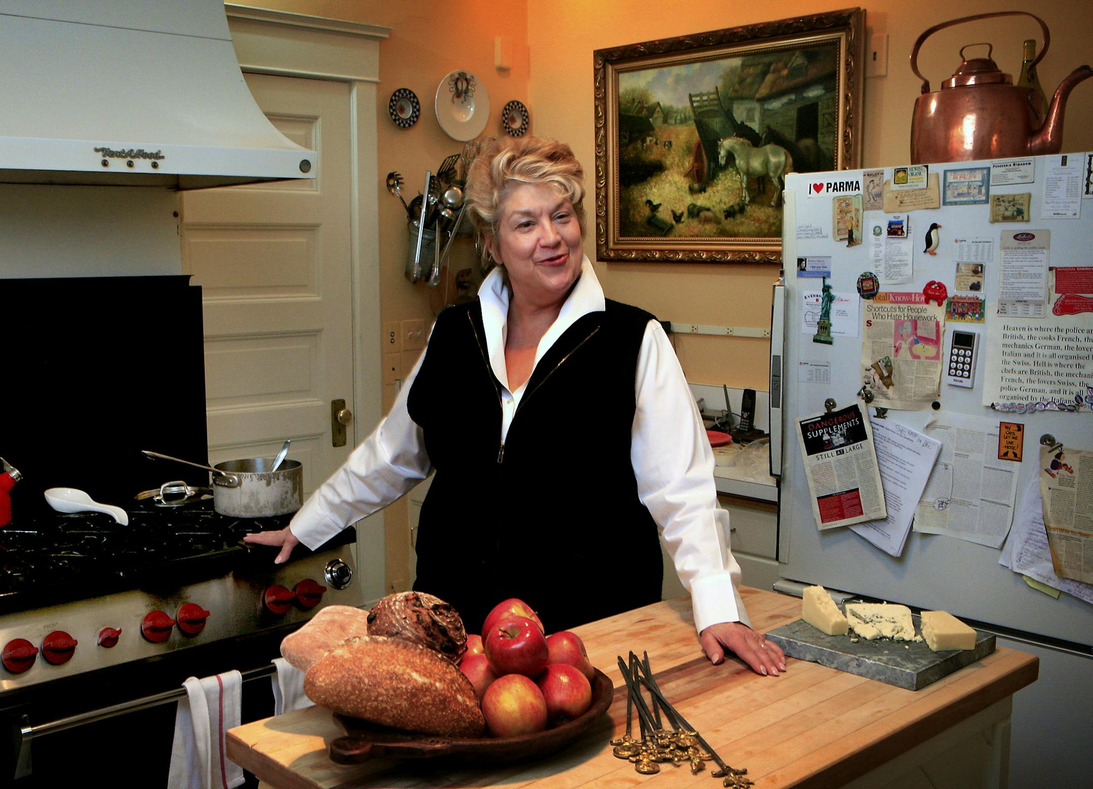 Steve Rice ï srice@startribune.com St. Paul, 01/25/2008] One of Lynn Rossetto Kasper's favorite rooms is her kitchen, which is only fitting for someone who writes cookbooks, has a cooking show on NPR, and loves to entertain. But her look and feel is casual, as can be seen by her note cover refrigerator. The 18,000 BTU Wolf stove behind her was purchased with her first royalty check from her book "The Splendid Table", and she calls it "Babe."bestmn2012 bestmn2012