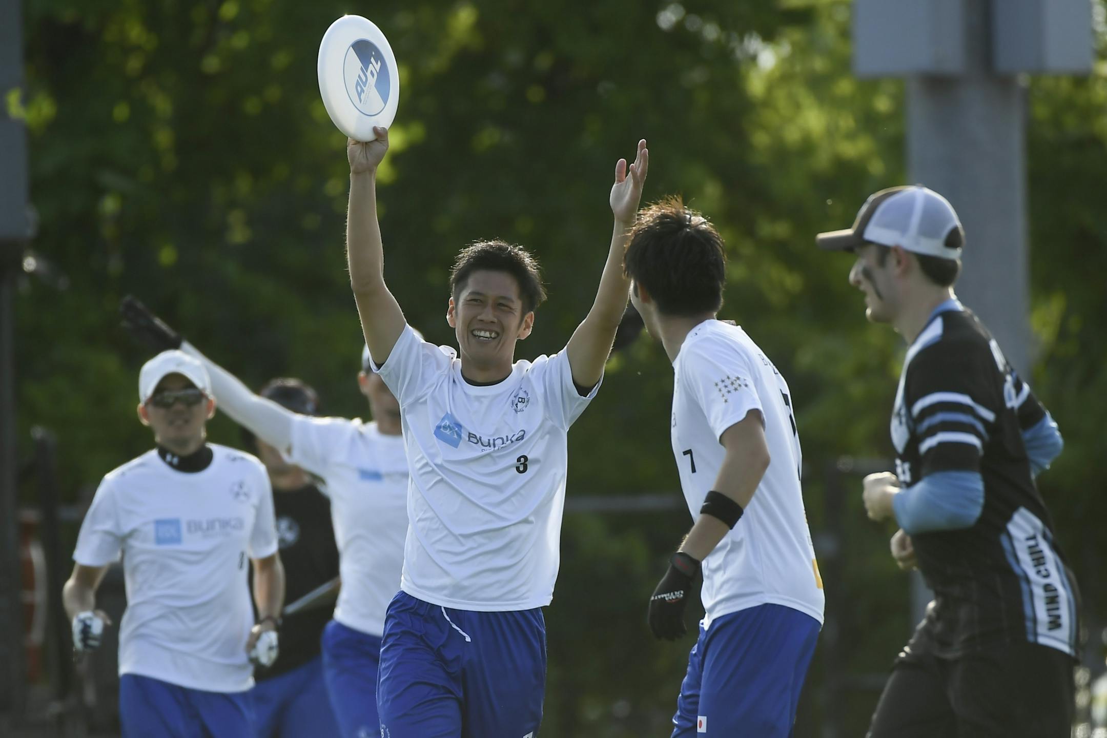 The Buzz Bullets' Yasuo Takahashi celebrated with teammates after scoring a point against the Minnesota Wind Chill.