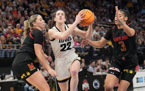 Iowa star Caitlin Clark (22) goes to the basket during last year's Big Ten tournament at Target Center.