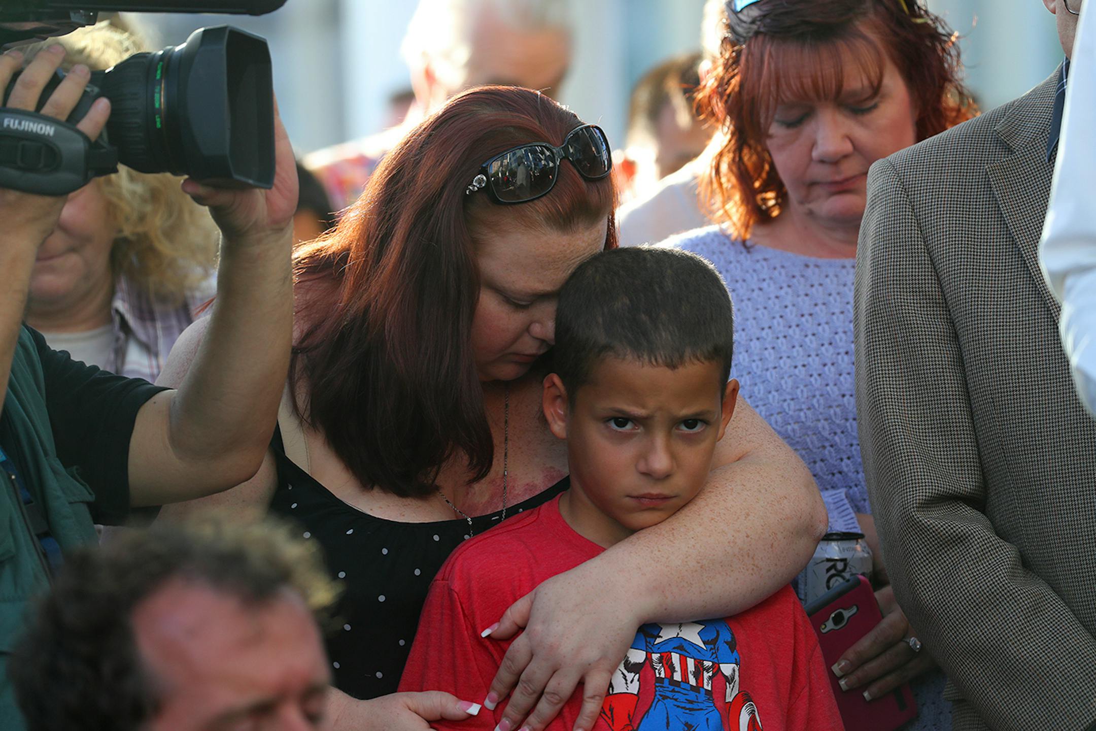 Amanda Douglas embraces her son Alexander Wells, 8, at a vigil for the victims of the deadly shooting that left at least 59 dead and 527 injured, at Las Vegas City Hall, Oct. 2, 2017. The gunman, identified as Stephen Paddock, rained a rapid-fire barrage on an outdoor concert festival in Las Vegas on Sunday night, resulting in one of the deadliest mass shootings in American history. (Jim Wilson/The New York Times)