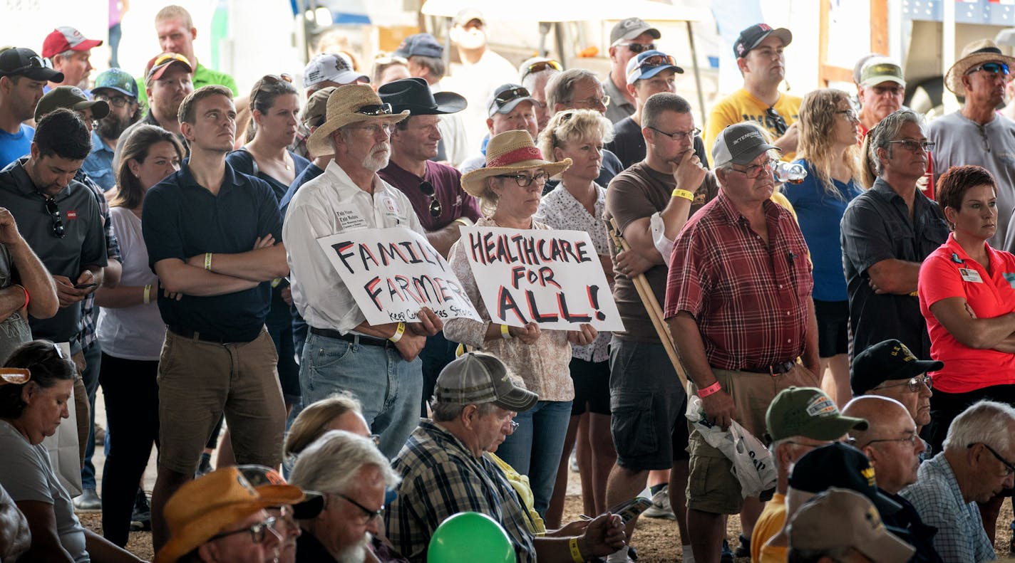 Some in the Farmfest crowd held signs. All five leading candidates for governor - Republicans Tim Pawlenty and Jeff Johnson, and DFLers Erin Murphy, Lori Swanson and Tim Walz - shared a stage for a forum at the FarmFest ag expo ] GLEN STUBBE &#xef; glen.stubbe@startribune.com Wednesday, August 8, 2018 All five leading candidates for governor - Republicans Tim Pawlenty and Jeff Johnson, and DFLers Erin Murphy, Lori Swanson and Tim Walz - shared a stage for a forum at the FarmFest ag expo in south