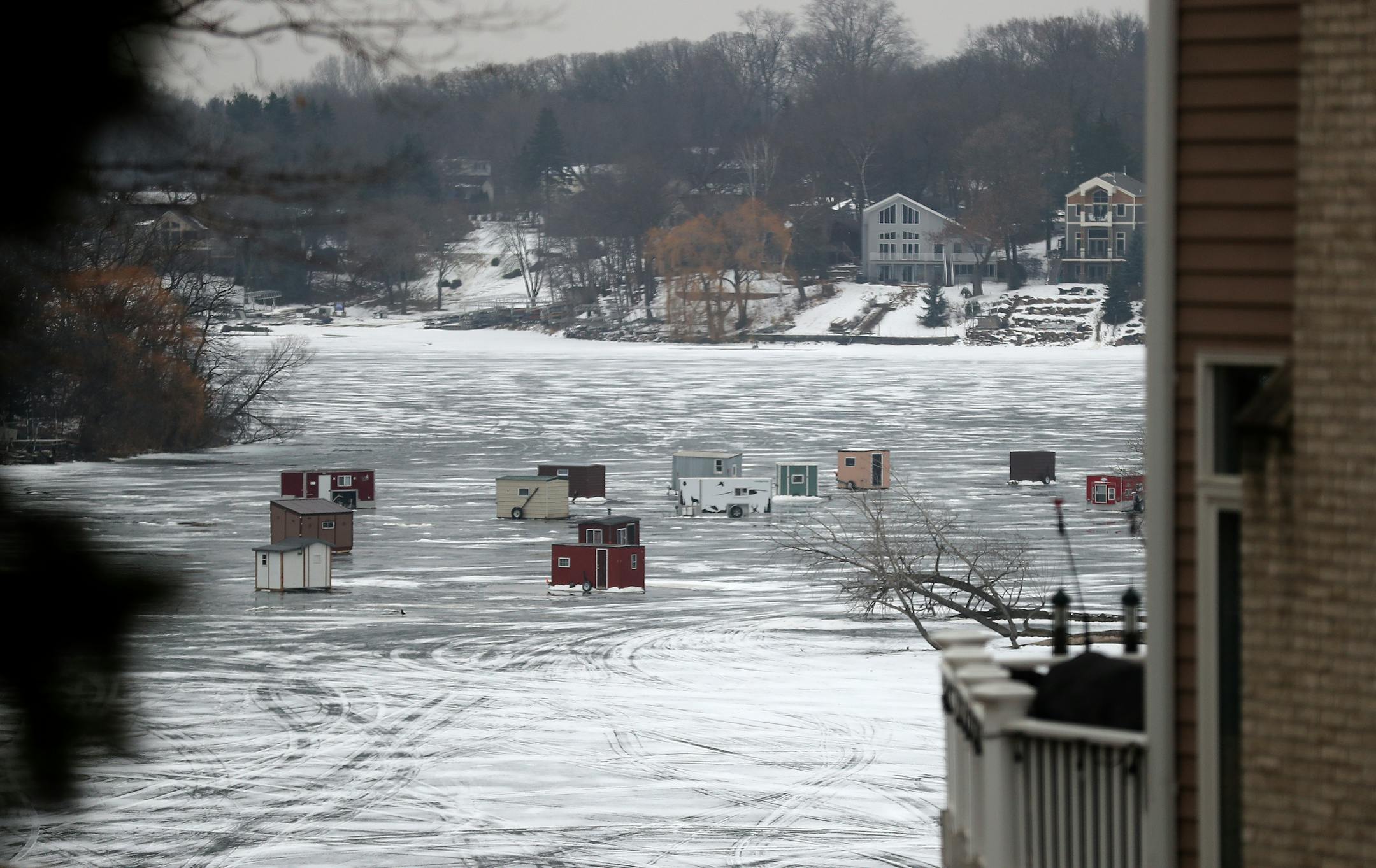 A cluster of ice fishing house is seen on lower Prior Lake on Wednesday