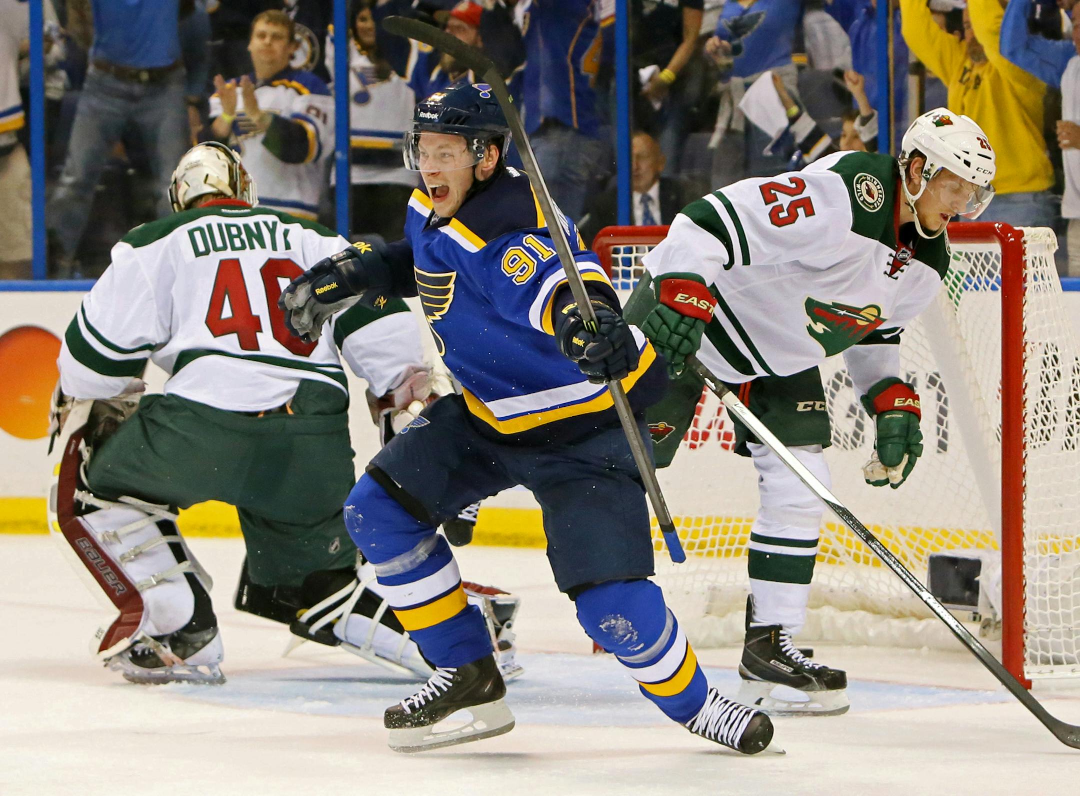 St. Louis Blues right wing Vladimir Tarasenko reacts after scoring his first of two goals in the first period during a first-round hockey playoff game between the St. Louis Blues and the Minnesota Wild on Saturday, April 18, 2015, at the Scottrade Center in St. Louis. At left is Minnesota Wild goaltender Devan Dubnyk and at right is defenseman Jonas Brodin. (Chris Lee/St. Louis Post-Dispatch via AP) EDWARDSVILLE INTELLIGENCER OUT; THE ALTON TELEGRAPH OUT; MANDATORY CREDIT ORG XMIT: MIN2015041817