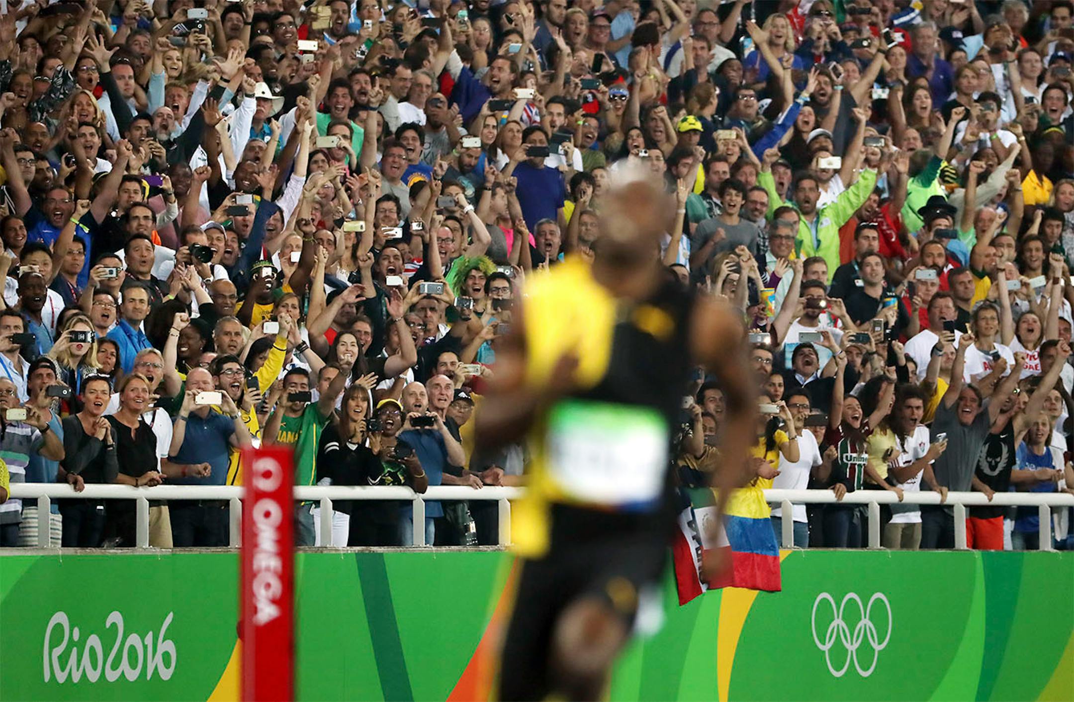 The fans go nuts after Bolt crosseds the finnish line in the 100, winning the gold medal. Men's 100 meter final. Jamaica's Usain Bolt, wins gold again beating USA's Justin Gatlin.