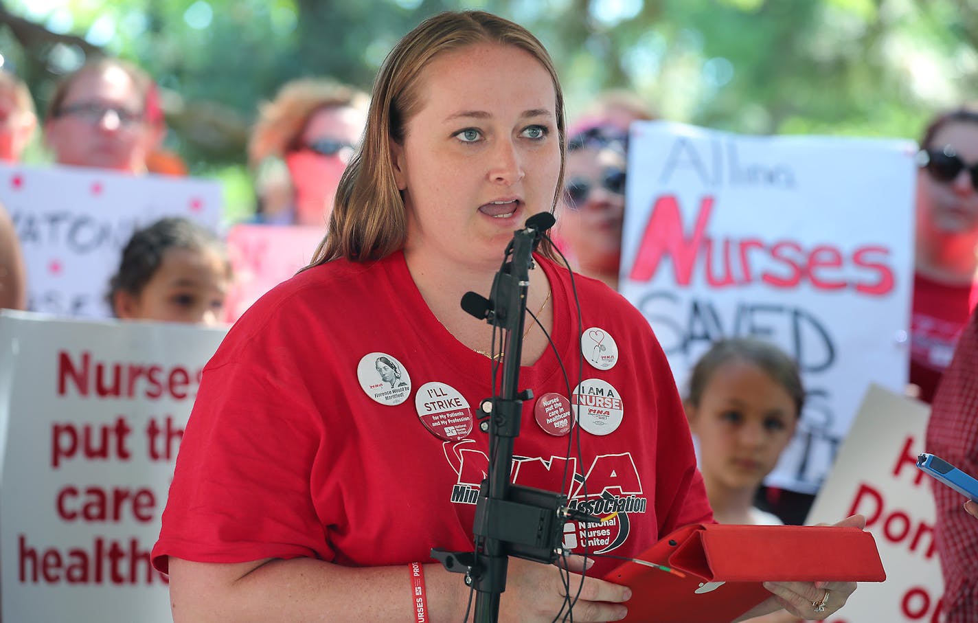 Angela Becchetti, an Abbott Northwestern nurse on the bargaining committee spoke on behalf of the Minnesota Nurses Association outside Abbott Northwestern Hospital as they continued their strike, Monday, June 20, 2016 in Minneapolis, MN. ] (ELIZABETH FLORES/STAR TRIBUNE) ELIZABETH FLORES &#x2022; eflores@startribune.com