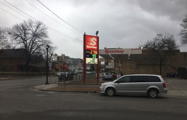 A crime lab technician worked at the scene where a man was shot Tuesday and later died outside a Minneapolis Speedway gas station. (Photo by Libor Jan