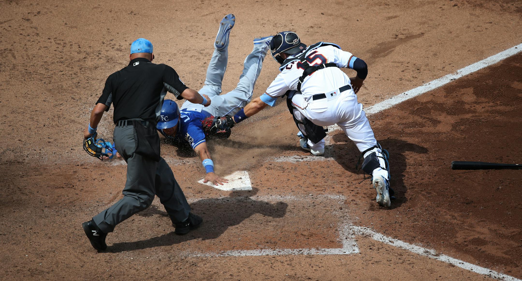 Umpire Vic Carapazza called the Royals' Nicky Lopez safe after he beat the tag of Twins catcher Jason Castro in the seventh inning of Kansas City's 8-6 victory at Target Field on Sunday.