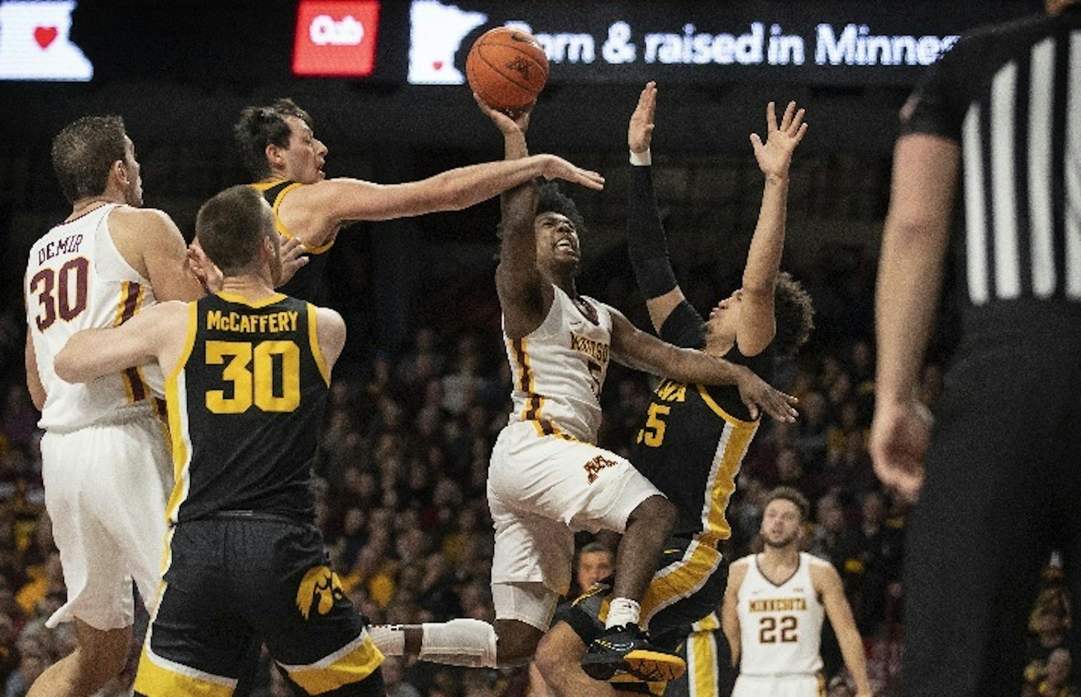 Gophers guard Marcus Carr drove to the basket on Hawkeyes forward Cordell Pemsl (35) on Sunday at Williams Arena. When Carr scores 12 or fewer points, the Gophers are 3-8 this season.