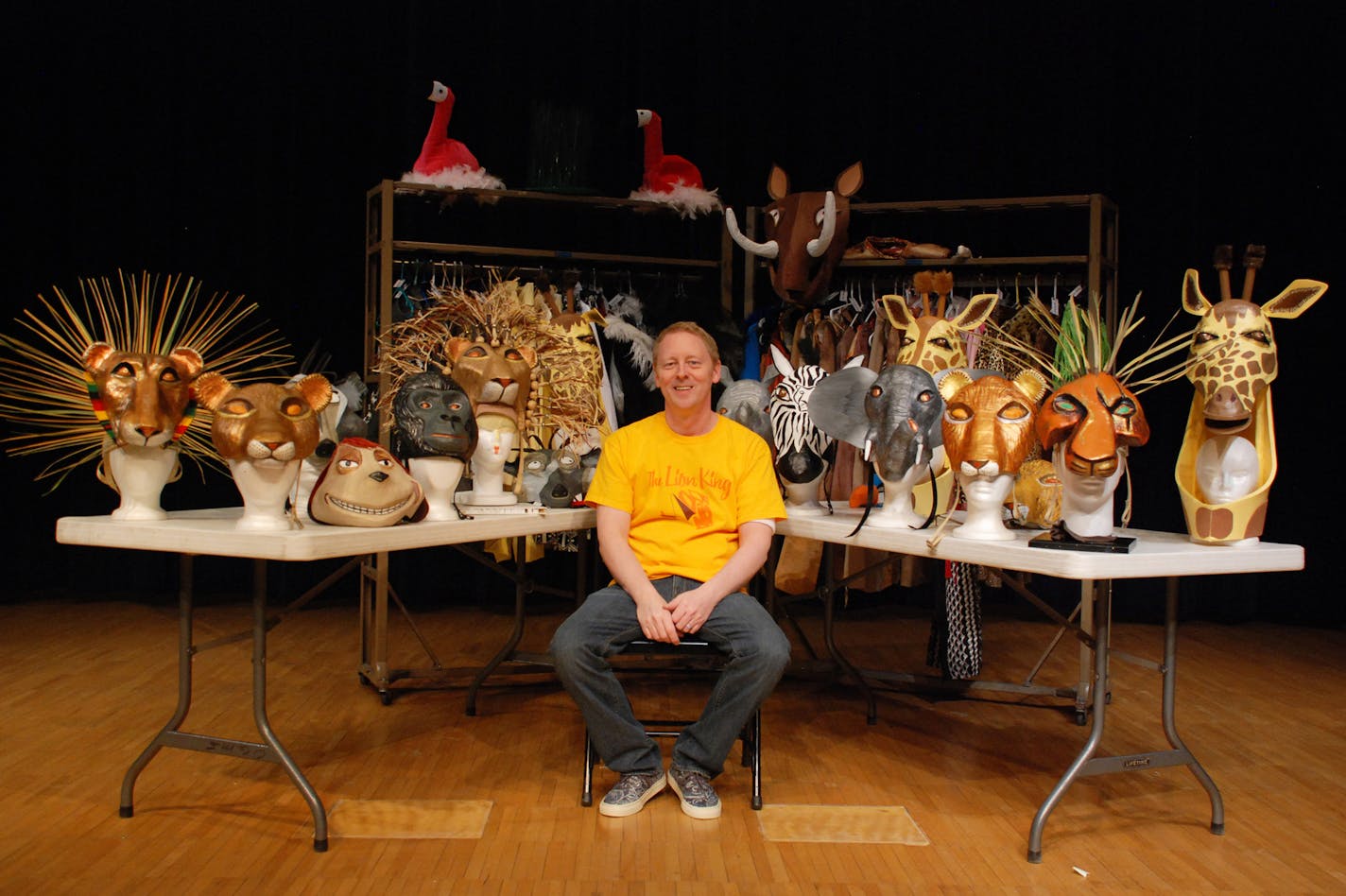 Kevin Doheny with the Lion King masks and costumes.Bloomington Public Schools