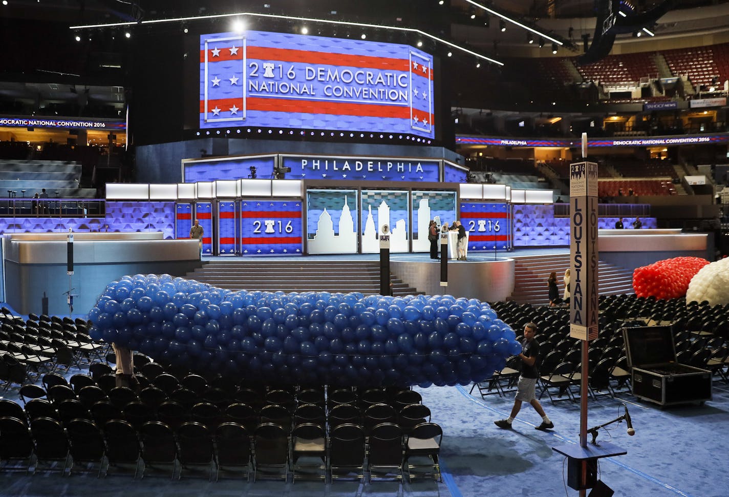 Workers prepare a mass of balloons for the 2016 Democratic National Convention, Friday, July 22, 2016, in Philadelphia. As Cleveland breathes a sigh of relief after protests during the Republican convention came and went without major chaos, eyes now turn to Philadelphia. (AP Photo/Matt Slocum)