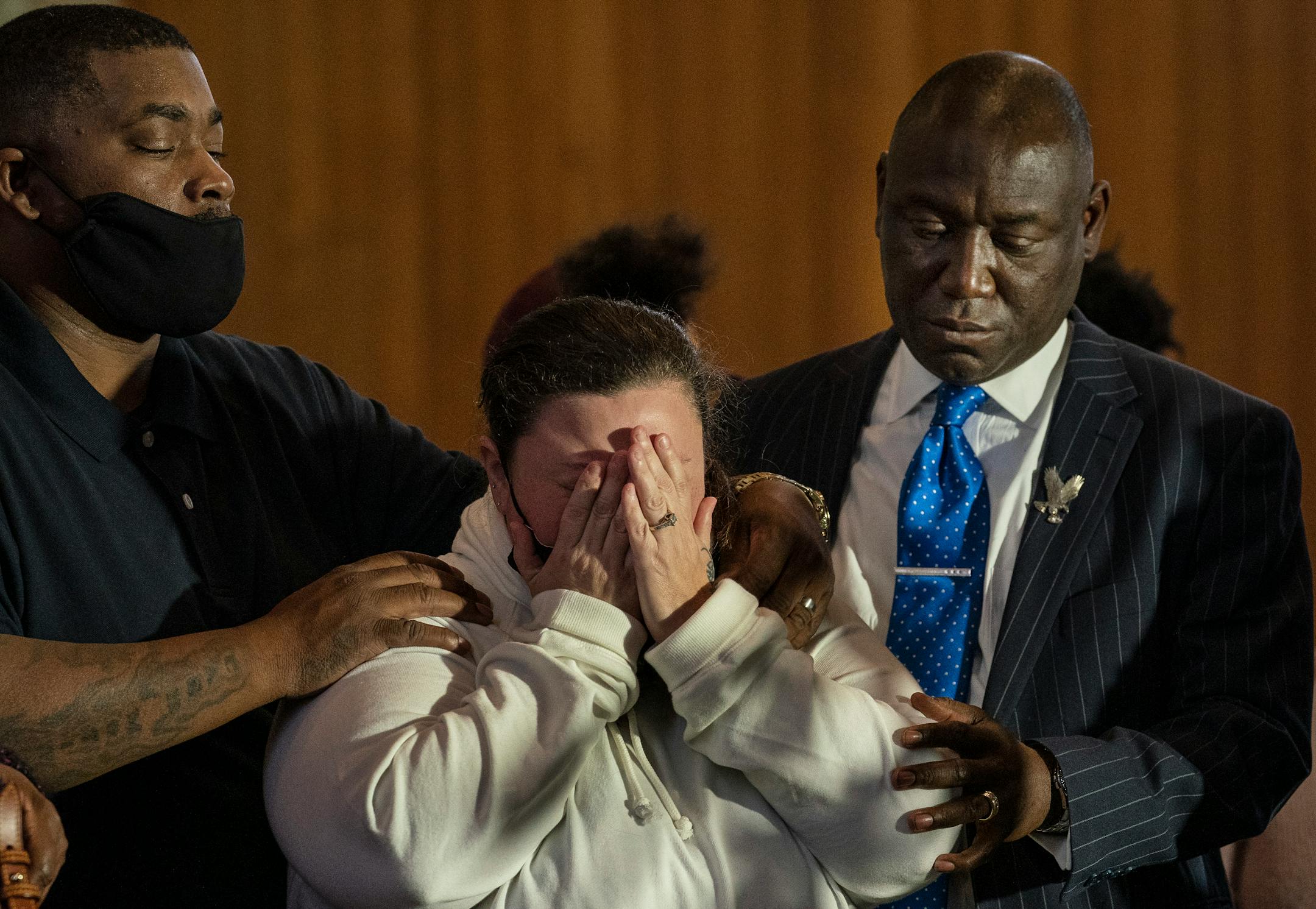 Aubrey Wright, left, and attorney Ben Crump consoled Katie Wright during a press conference at New Salem Missionary Baptist Church in Minneapolis.