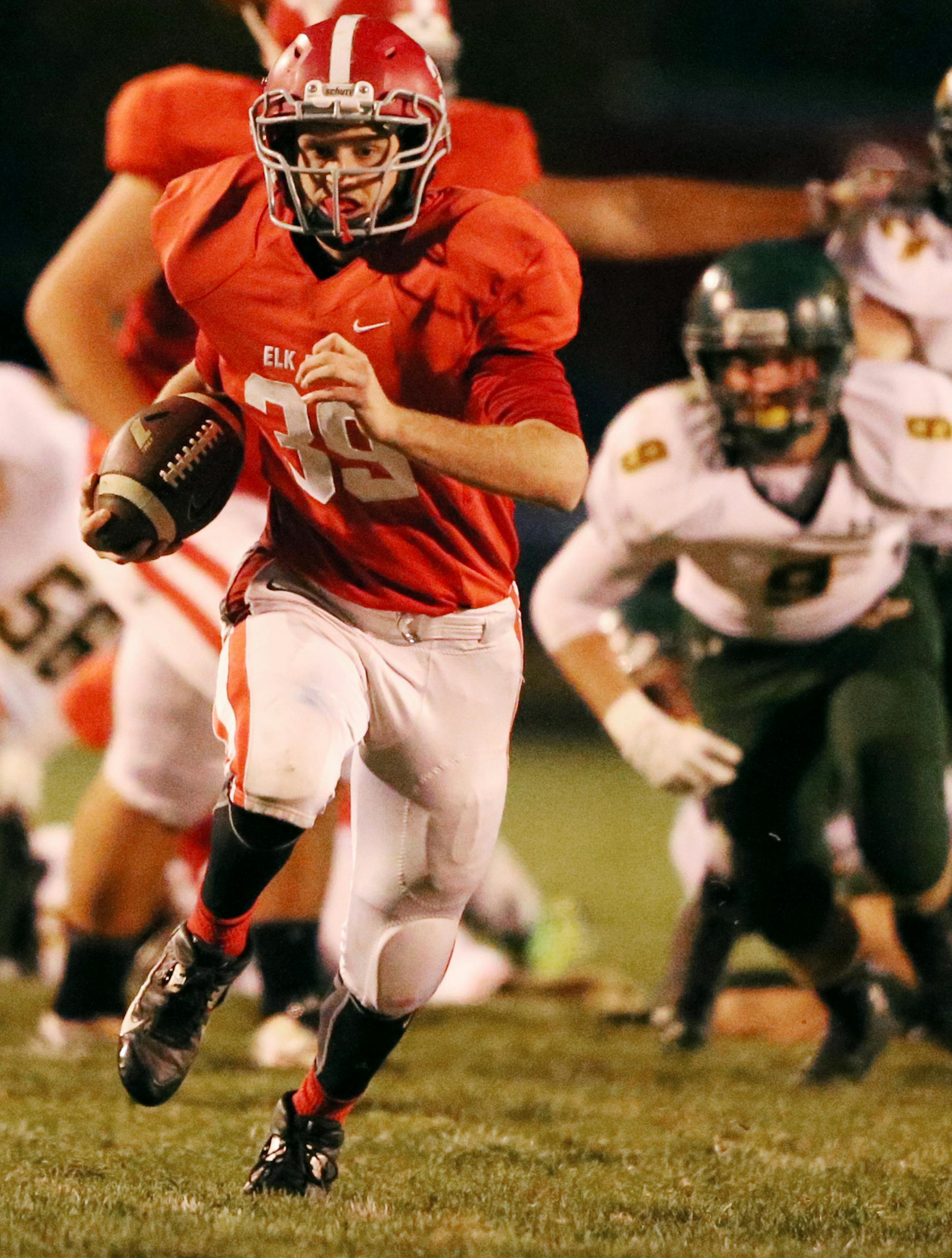 Elk River running back Jack Kolar ran through a big hole on the Sauk Rapids-Rice defense at Elk River High School Tuesday October 13, 2015 in Elk River, MN. ] Elk River hosted Sauk Rapids-Rice in the section 6 class 5-A playoffs . Jerry Holt/ Jerry.Holt@Startribune.com