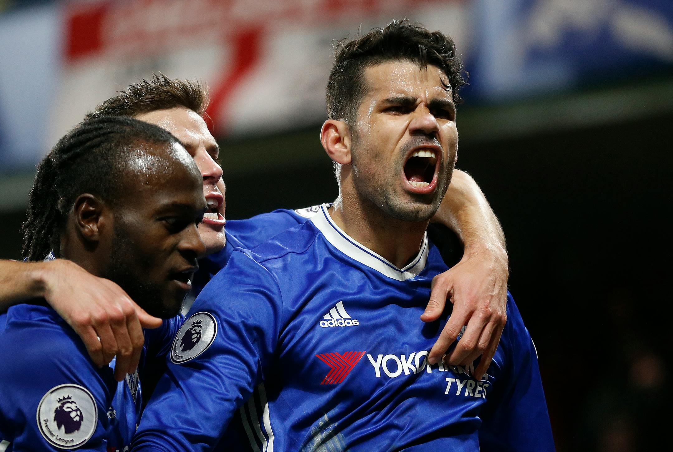 Chelsea's Diego Costa celebrated with teammates after scoring during the English Premier League soccer match between Chelsea and Hull City at Stamford Bridge stadium in London on Sunday.