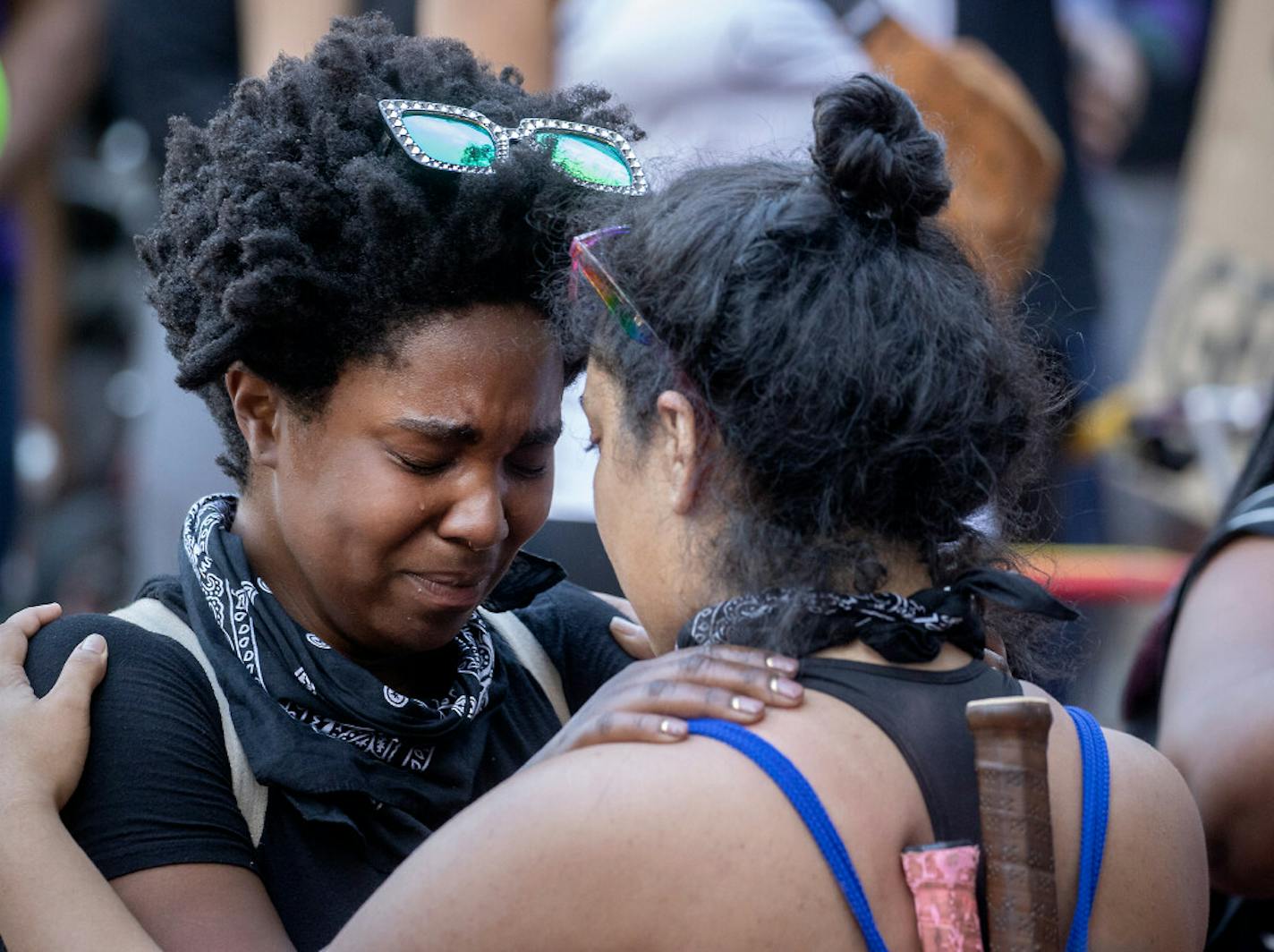 Protesters stood outside the Hennepin County Government Center in downtown Minneapolis on Thursday in support of arresting fired police officers in the death of George Floyd.