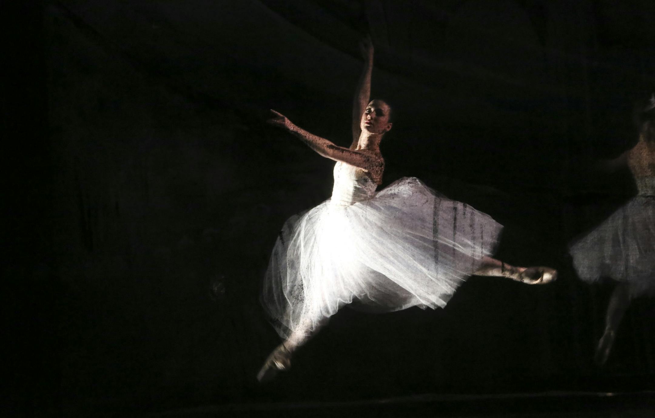 Behind a screen dancers performed the Nutcracker for the audience at the Colwes Center in Minneapolis Min., Friday December 14, 2012.