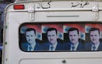 DAMASCUS -11/10/01 - Faces and Voices of the Islamic World. IN THIS PHOTO: President Bashar al-Assad's likeness is ubiquitous in Syria, as is that of 