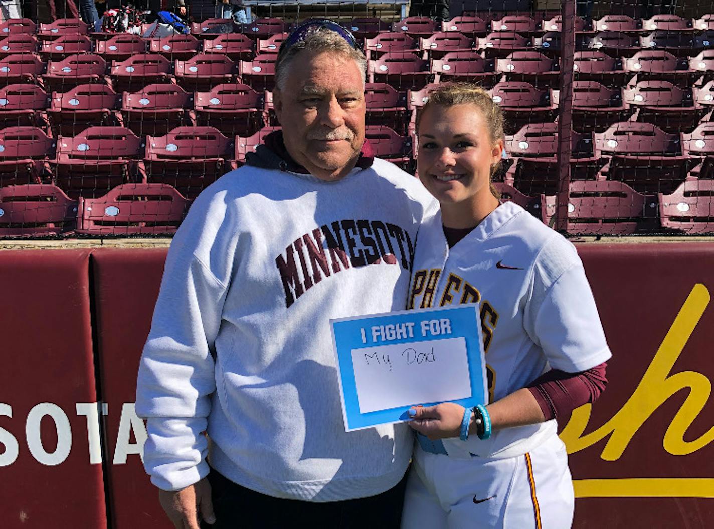 Gophers softball pitcher Amber Fiser with her father, Rob Fiser. (Courtesy University of Minnesota athletics)