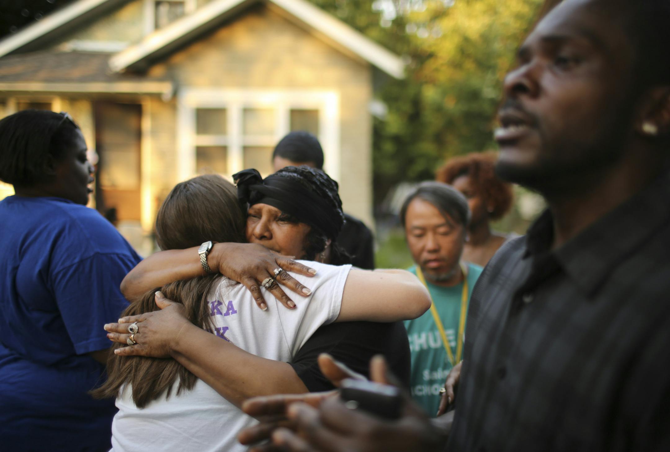 Deborah Lott, mother of Cabrie Young, accepted condolences from a young person who attended the community vigil for Cabrie Young Wednesday evening. ] JEFF WHEELER ‚Ä¢ jeff.wheeler@startribune.com A community vigil was held on Dupont Ave N. at 34th St. Wednesday evening, July 9, 2014 for Cabrie Young, the young father of five who was shot and killed last weekend.