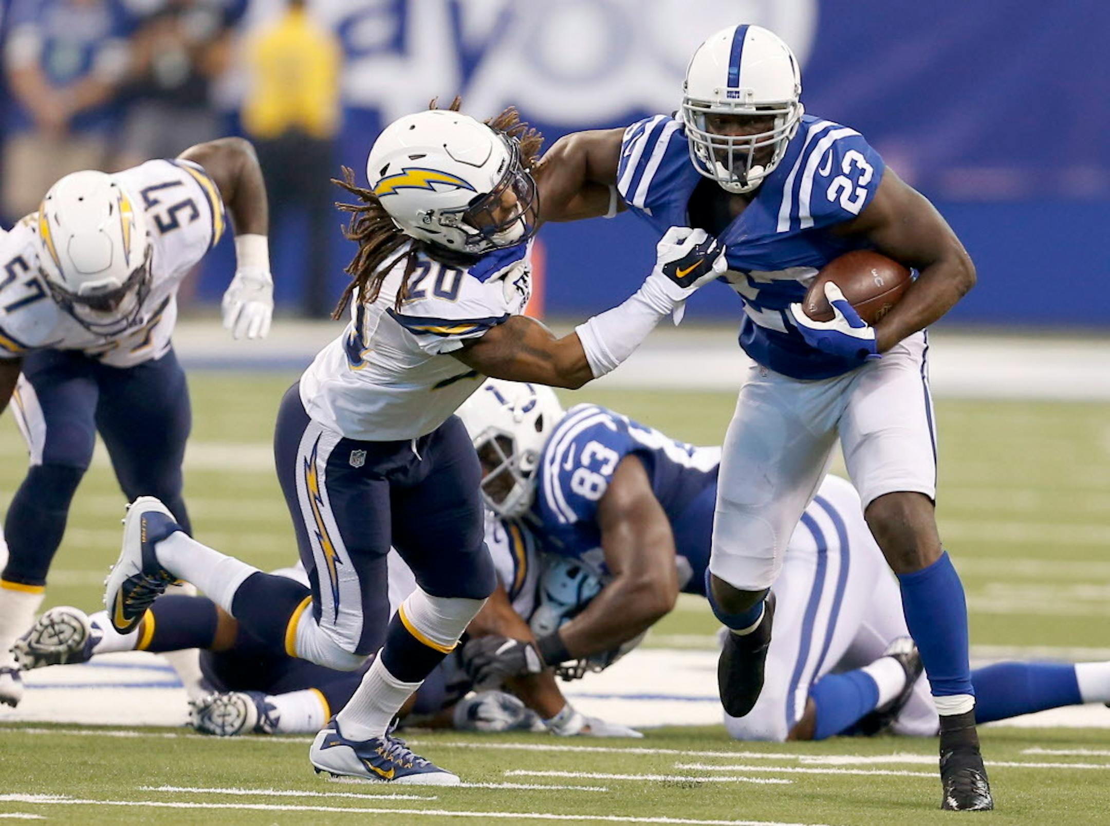 Indianapolis Colts running back Frank Gore (23) tries to escape San Diego Chargers free safety Dwight Lowery (20) in first half action at Lucas Oil Stadium Sunday, Sept. 25, 2016 in Indianapolis, Ind. The Colts won 26-22. (Sam Riche/TNS) ORG XMIT: 1190687