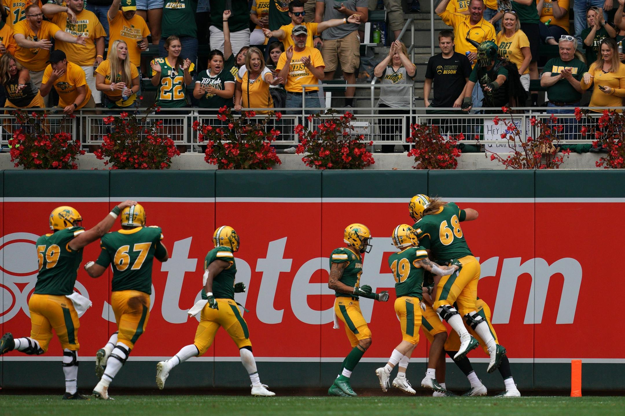 North Dakota State Bison players celebrated in the end zone after North Dakota State Bison quarterback Trey Lance (5) ran the ball in for a touchdown in the second half.