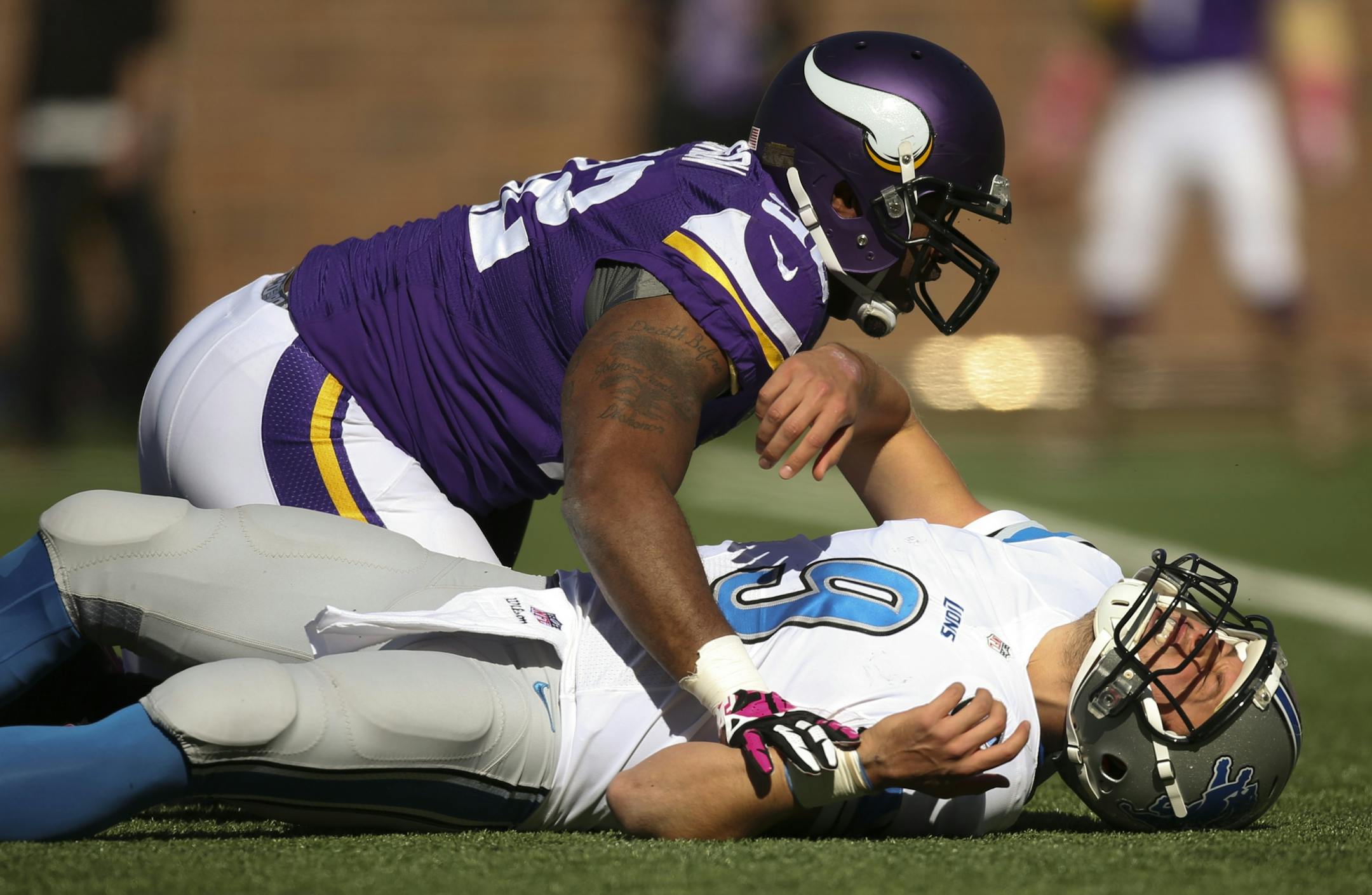 Minnesota Vikings defensive tackle Tom Johnson (92) slammed Detroit Lions quarterback Matthew Stafford (9) to the ground earlier this season.