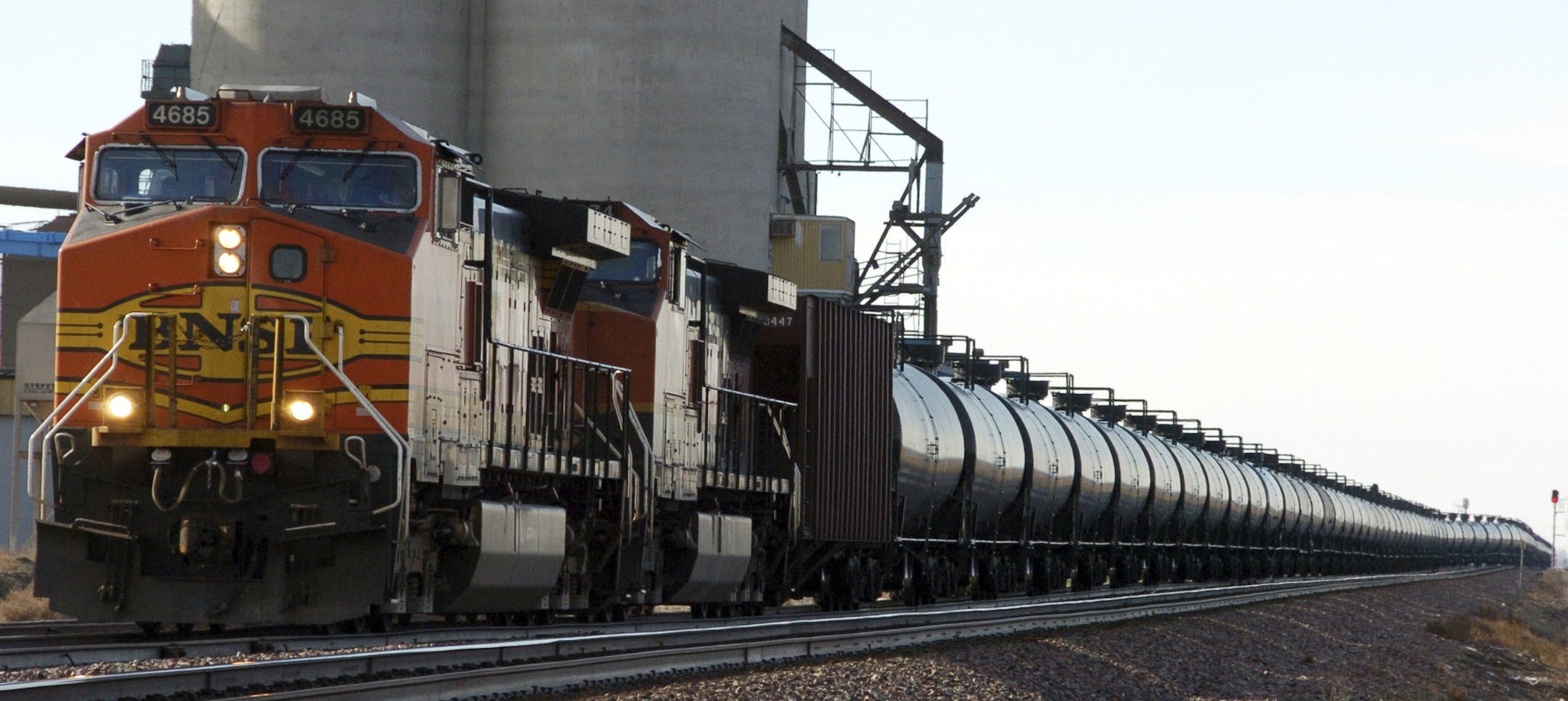 FILE - In this Nov. 6, 2013, file photo, a BNSF Railway train hauls crude oil near Wolf Point, Mont. The U.S. Department of Transportation ordered railroads last month to give state officials specifics on oil train routes and volumes so emergency responders can better prepare for accidents. North Dakota's State Emergency Response Commission unanimously voted to release the state's information Wednesday June 25, 2014. (AP Photo/Matthew Brown, File) ORG XMIT: MIN2014072519284756 ORG XMIT: MIN14072