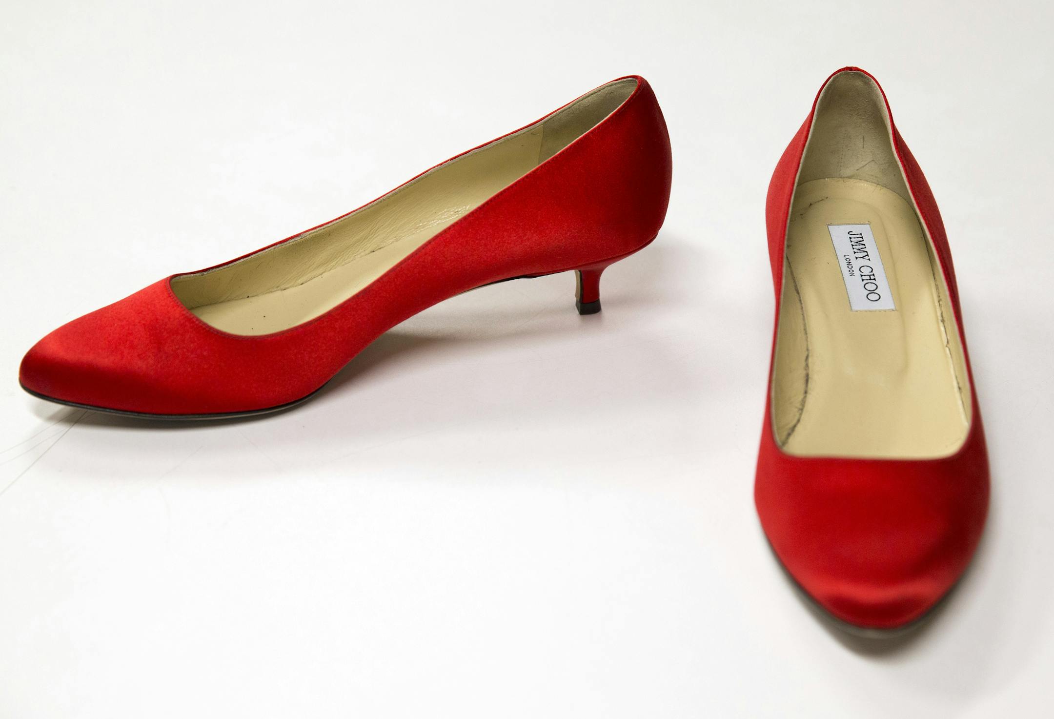 A pair of Jimmy Choo shoes worn by first lady Michelle Obama with her second inaugural gown are shown in a storage area at the Smithsonian Museum of American History on Monday, Jan. 13, 2014 in Washington.†The White House is lending Obamaís ruby-colored chiffon gown made by designer Jason Wu to the National Museum of American History for a year to coincide with the 100th anniversary of the Smithsonianís first ladies exhibition. It will be paired with Obamaís shoes designed