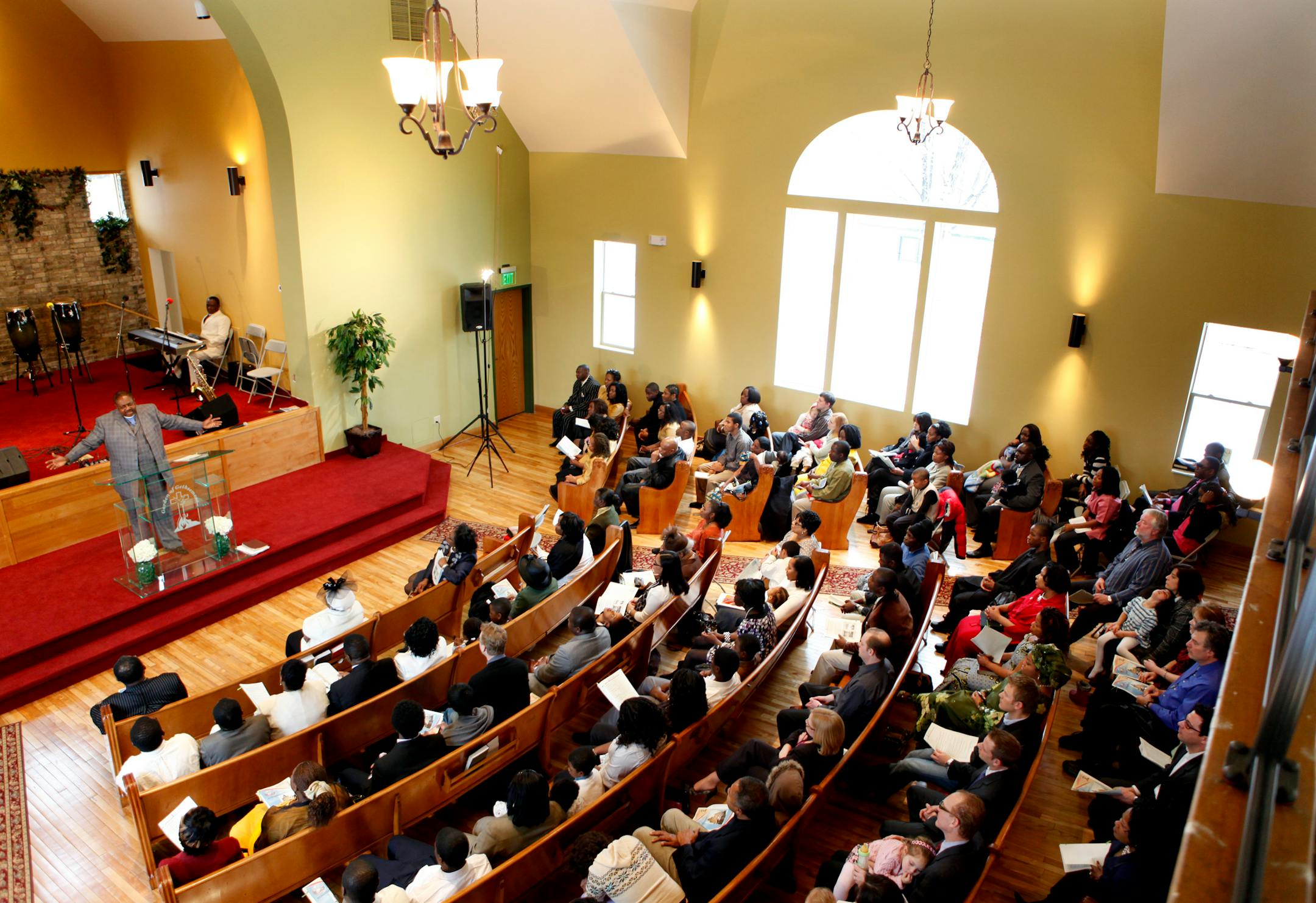 Pastor Randolph Cooper welcomed parishioners and well-wishers to Garden of Gethsemane Church on Friday for an inaugural service to mark the completion of the century-old church's renovation. The nondenominational congregation, made up largely of Liberian immigrants, bought the structure five years ago.