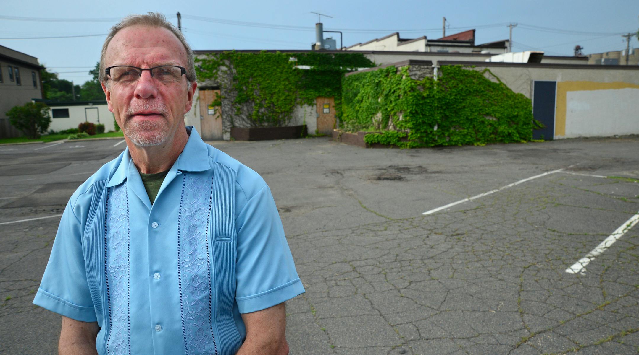 Plans are finally moving ahead for the rehabilitation of the vacant former Little Jack's restaurant on Lowry Avenue in Northeast Minneapolis into a new restaurant and/or other commercial use, while non-profit developer Clare Housing is to construct a new affordable apartment building for people living with HIV/AIDS next door on what is now a surface parking lot. Lee Lewis of Clare Housing stood in the parking lot where the apartment building for people living with HIV/AIDS will be built. ] Richa