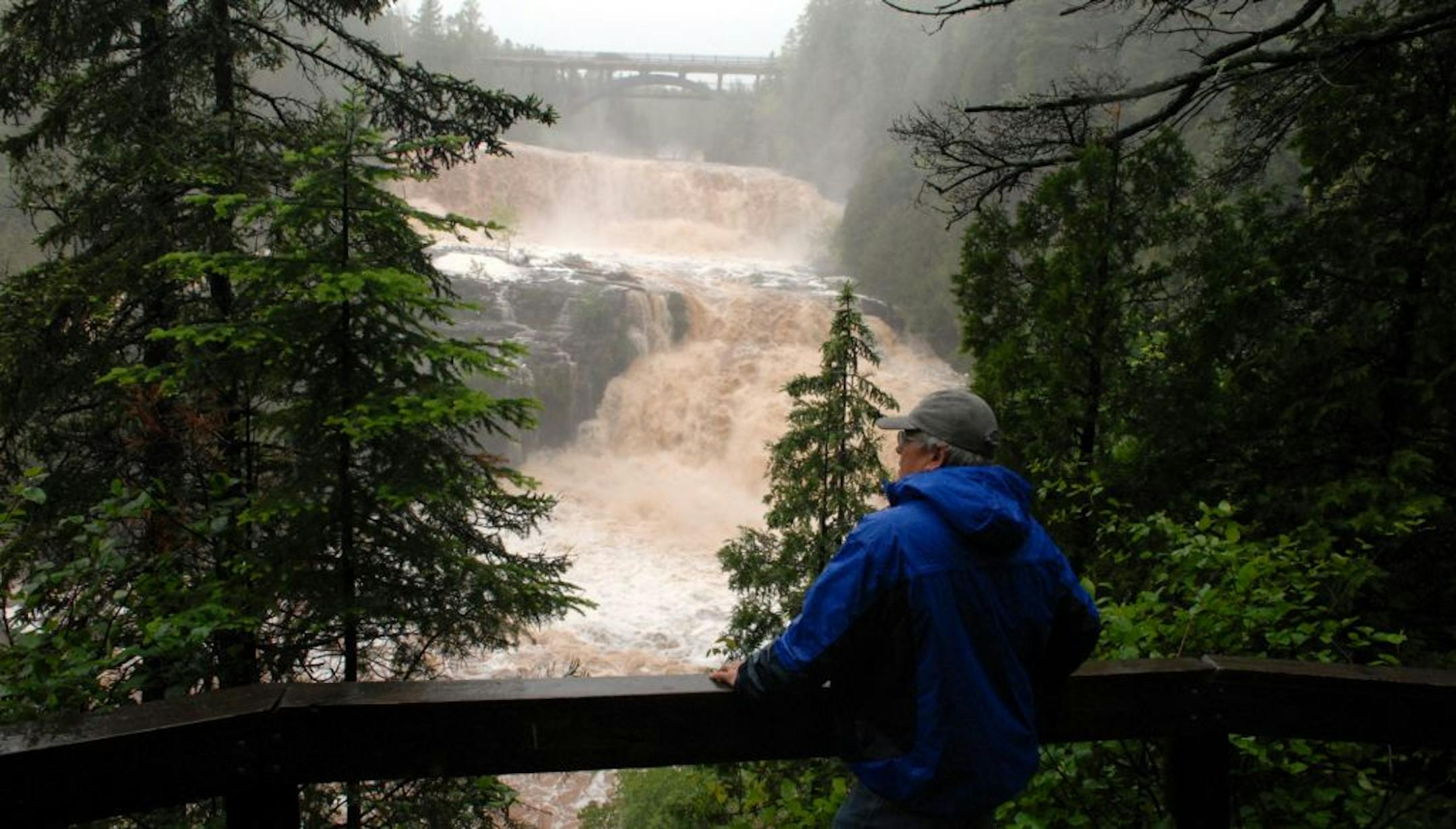 Retired Gooseberry Falls State Park manager Paul Sundberg overlooked the raging waters of the Gooseberry River on Wednesday. "If the state parks close down July 1 due to a government shutdown, the effect would be devastating,'' Sundberg said.
