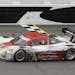 Joao Barbosa, of Portugal, drives the Action Express Corvette DP to the finish line to win the IMSA Series Rolex 24 hour auto race at Daytona Internat