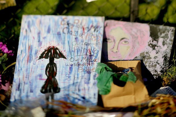 Two paintings left behind as a memento by Prince fans outside Paisley Park Sunday May 15, 2016, in Chanhassen, MN.