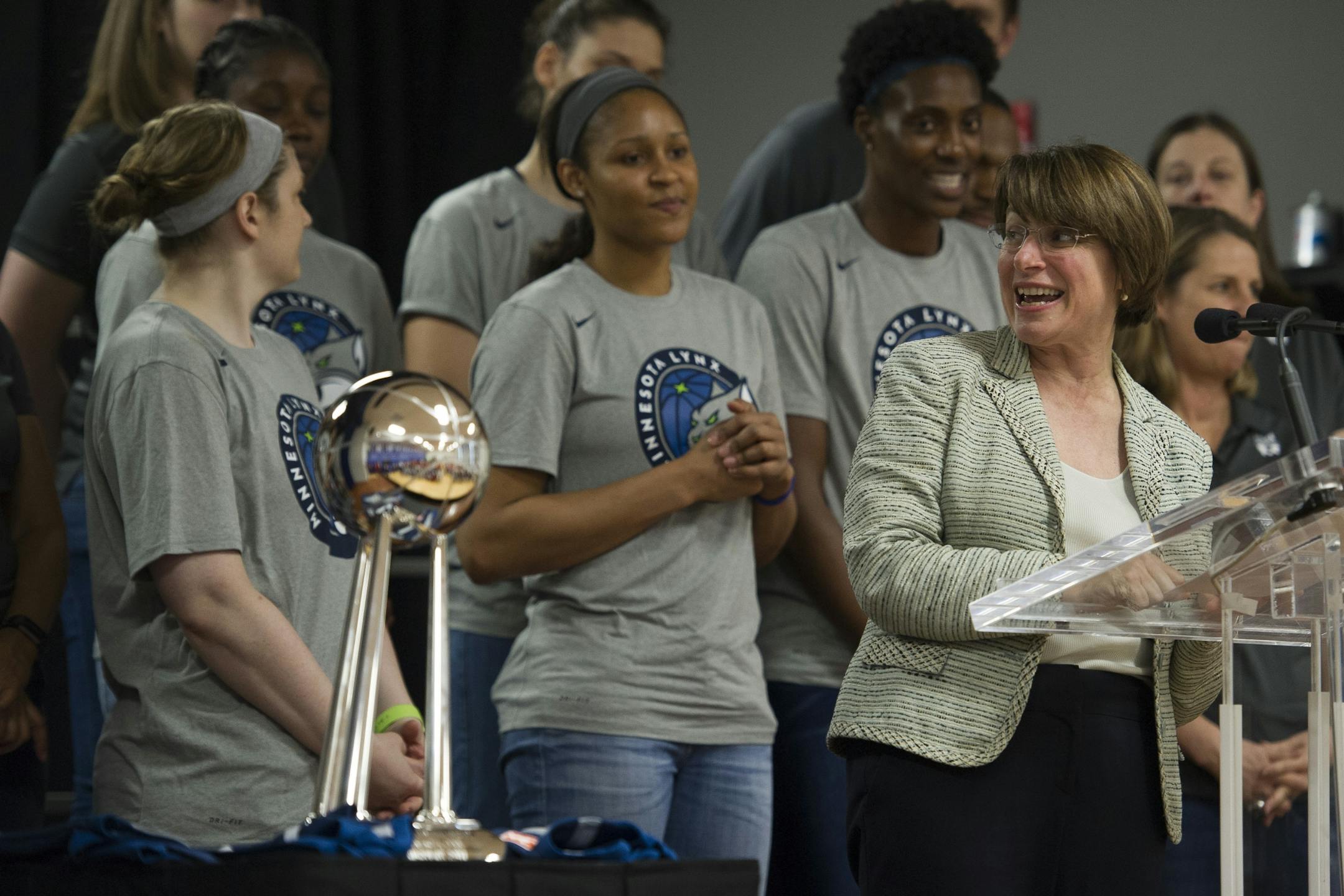 Sen. Amy Klobuchar, D-Minn., right, congratulates the WNBA Minnesota Lynx for their Championship season, at Payne Elementary School in Washington, Wednesday, June 6, 2018. Payne Elementary has the highest homeless student population in the district.