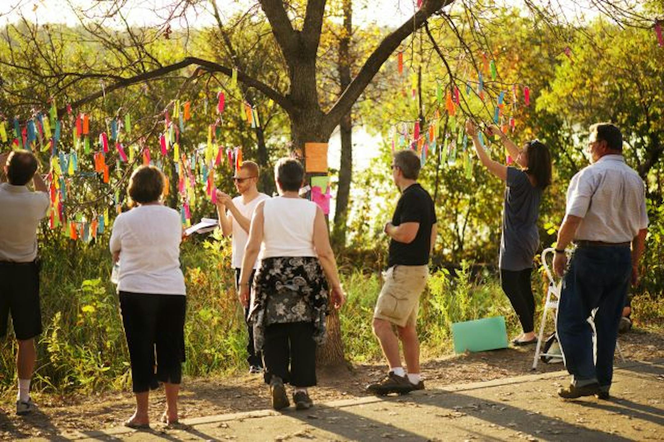 Even as Deb Arora was taking down the wishes, people walking around Lake Harriet stopped and added a few more.