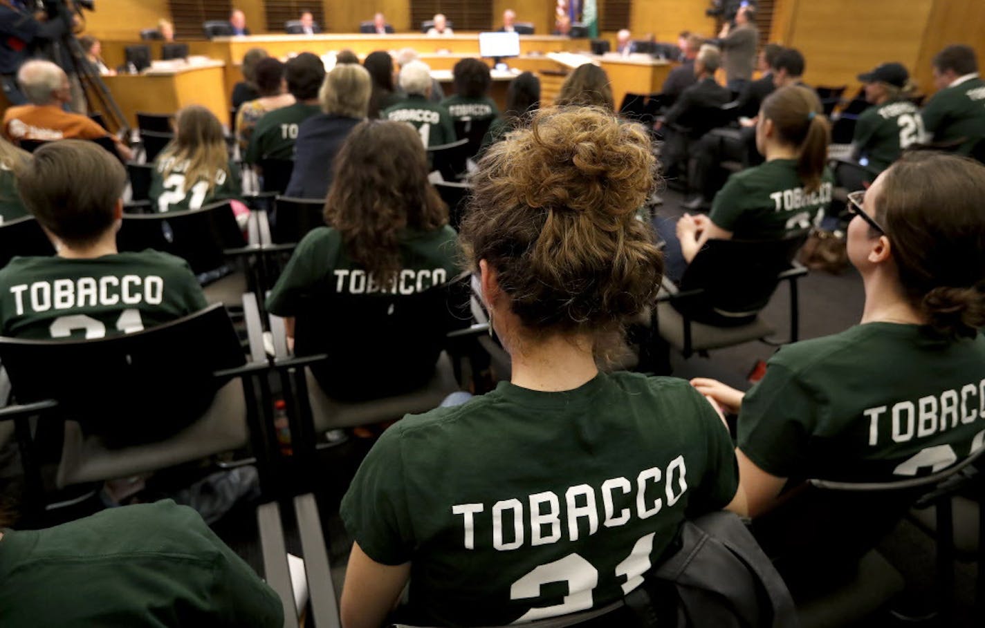 Supporters wearing green shirts after the city council amended Tobacco sales in Edina from a minimum age of 18 to 21. ] CARLOS GONZALEZ &#xef; cgonzalez@startribune.com - May 2, 2017, Edina, MN, Edina is expected to vote to raise the age of tobacco sales in the city from 18 to 21 at tonight's City Council meeting.