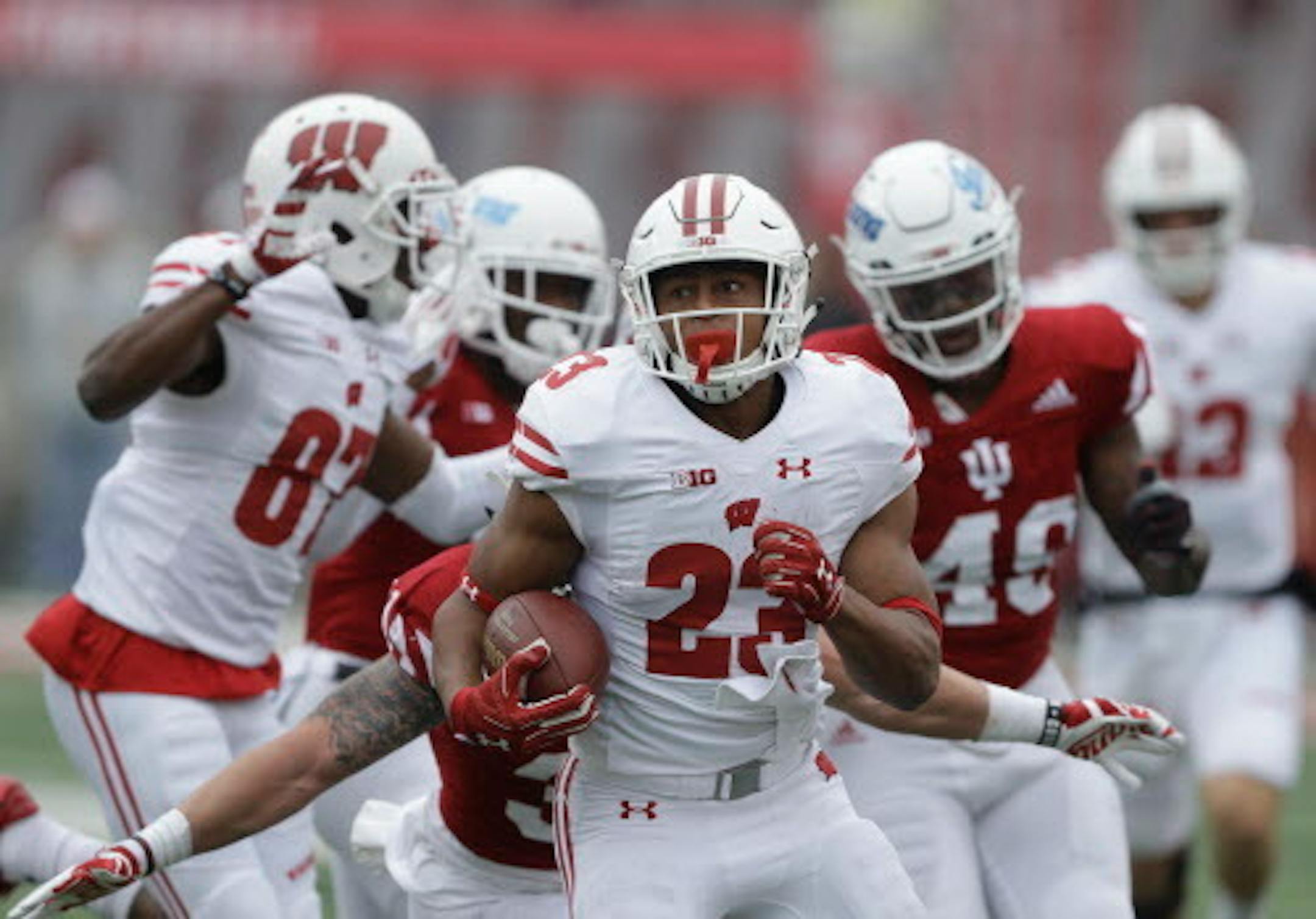 FILE - in this Saturday, Nov. 4, 2017, file photo, Wisconsin running back Jonathan Taylor (23) runs during the first half of an NCAA college football game against Indiana in Bloomington, Ind. Taylor, the Big Ten's leading rusher, will play in the biggest game yet of his first college season on Saturday against Iowa.  (AP Photo/Darron Cummings, File)