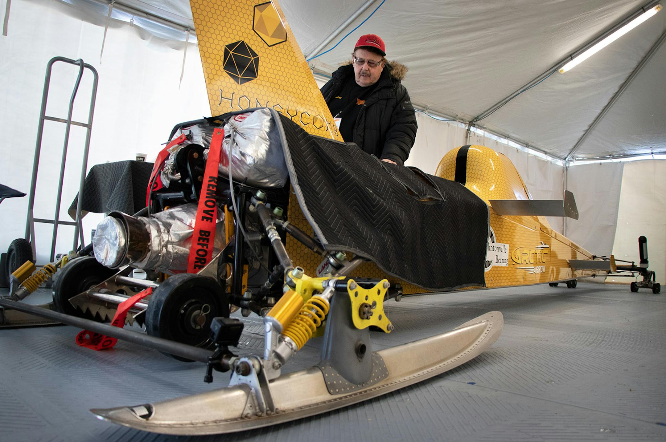 Ky Michaelson inspects the Arctic Arrow as it�s fuel heats before a run on Sunday, Feb. 16, 2020 on Bear Lake in Manawa, WI.