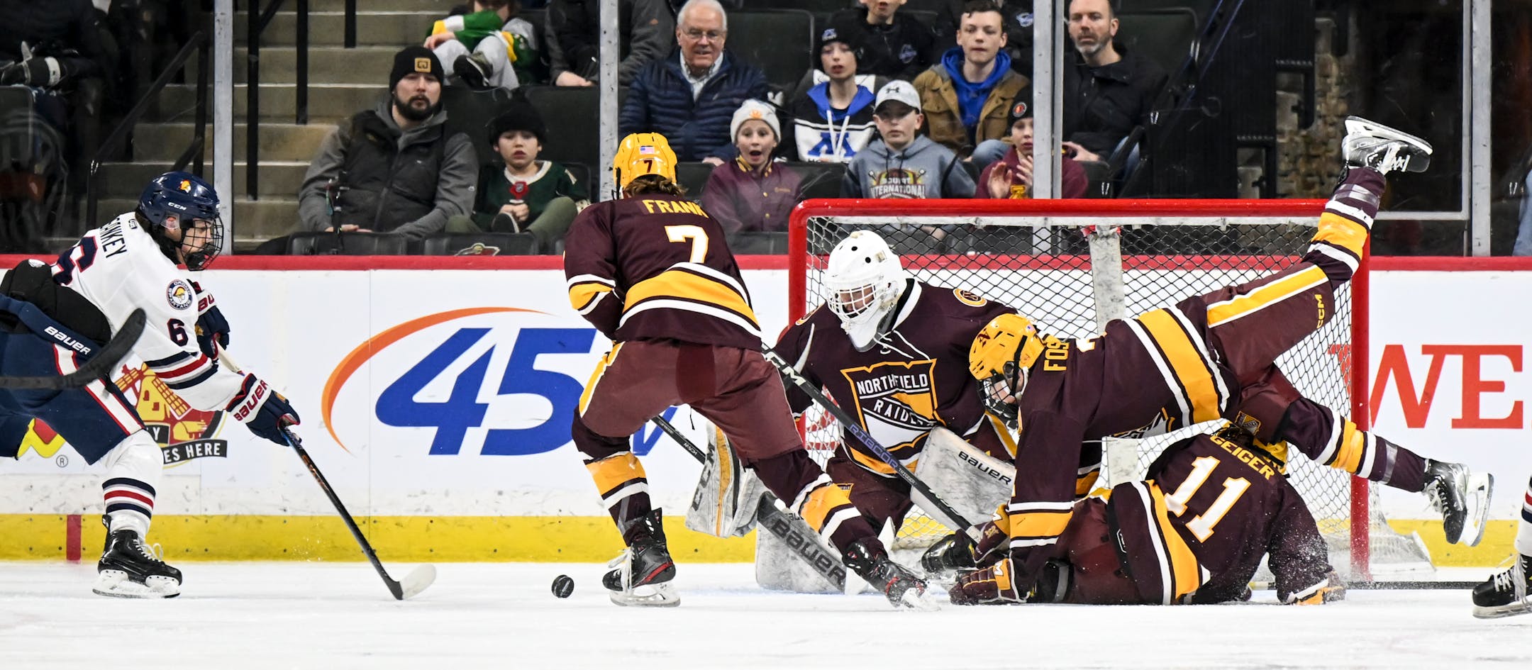 Orono forward Easton Sankey (6) attempts a shot against Northfield goaltender Walock, Keaton (30) as Northfield defenseman Michael Fossum (2) collides with forward Jacob Geiger (11) during the first period of a Class 1A State Tournament boys hockey quarterfinal game Wednesday, March 8, 2023 at the Xcel Energy Center in St. Paul, Minn.