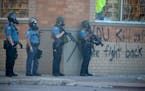 St. Paul police fired tear gas on protesters along University Avenue in May during protests following the death of George Floyd while in Minneapolis p