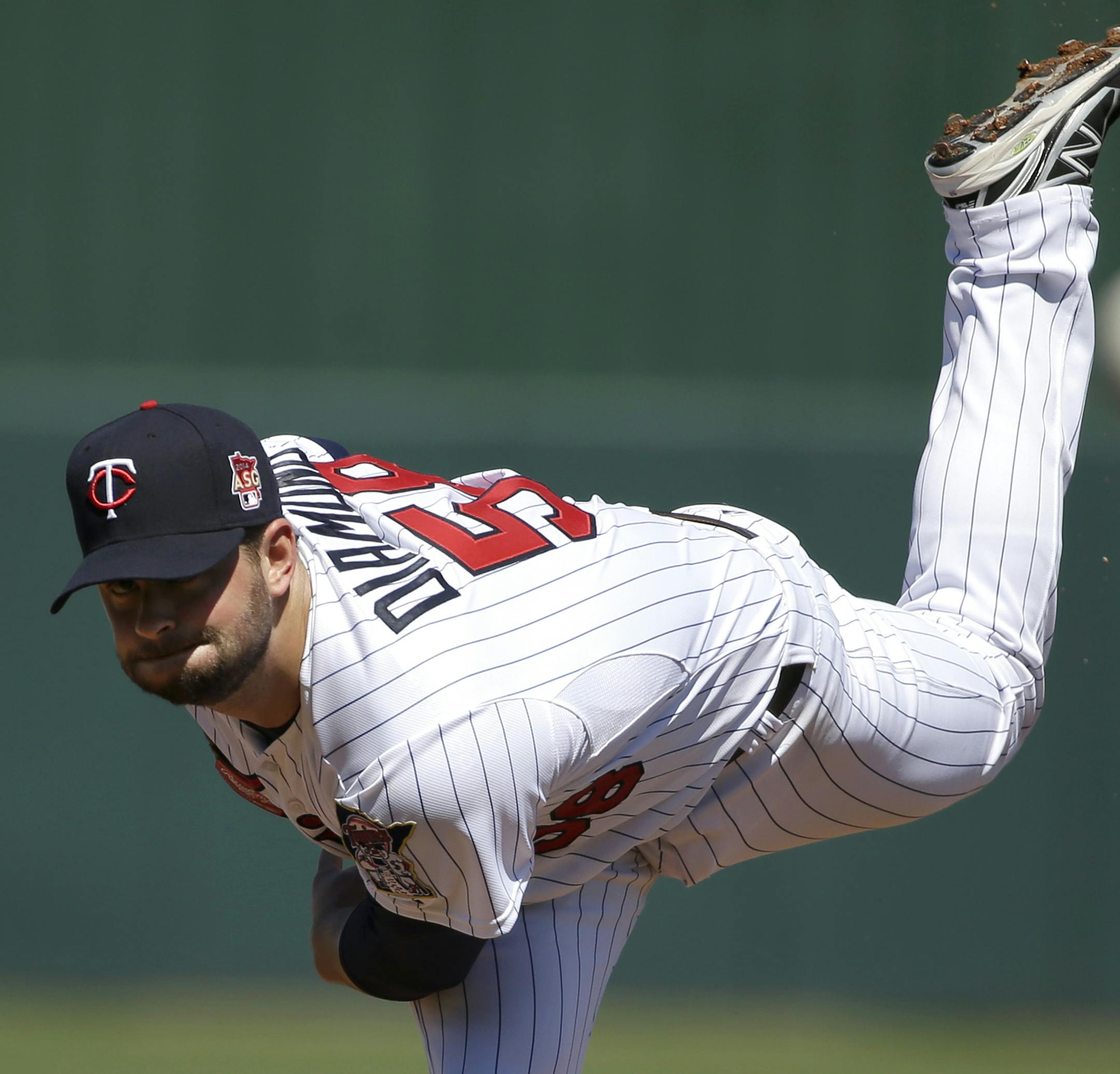 Minnesota Twins pitcher Scott Diamond delivers a warm-up throw in the first inning of an exhibition baseball game against the Boston Red Sox, Saturday, March 1, 2014, in Fort Myers, Fla. The Twins beat the Red Sox 6-2. (AP Photo/Steven Senne)
