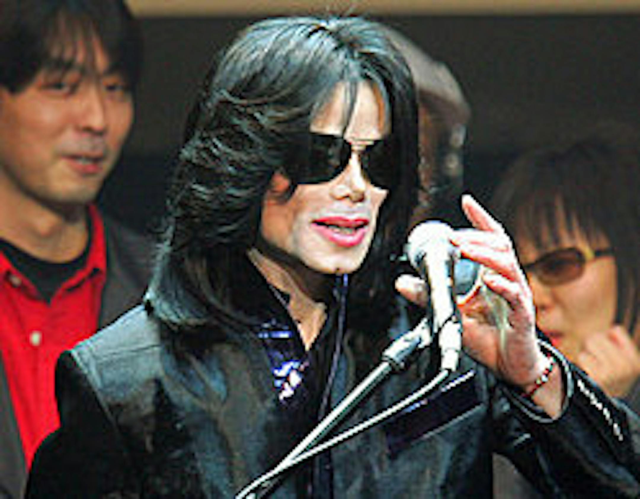 **FILE** Michael Jackson delivers his speech to fans during an event "Fan Appreciation Day" in Tokyo on March 9, 2007. Jackson is "a little bit under the weather," but has not sought hospital treatment, his spokeswoman said Thursday, March 29, 2007. (AP Photo/Itsuo Inouye)