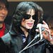 **FILE** Michael Jackson delivers his speech to fans during an event "Fan Appreciation Day" in Tokyo on March 9, 2007. Jackson is "a little bit under 