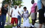 Family and friends of RayVell Carter, as well as neighbors and members of the faith community, took part in a prayer circle Wednesday afternoon outsid