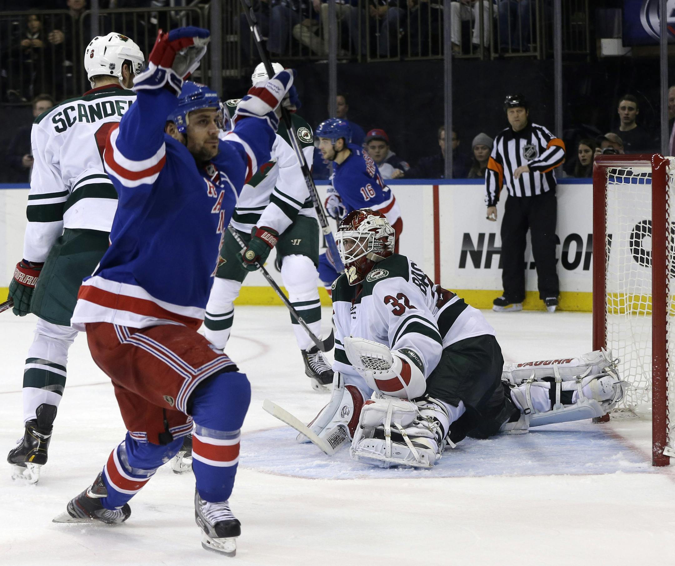 Minnesota Wild goalie Niklas Backstrom (32) reacts after being scored on by New York Rangers' Mats Zuccarello, left, during the second period of an NHL hockey game, Sunday, Dec. 22, 2013, in New York. (AP Photo/Seth Wenig)
