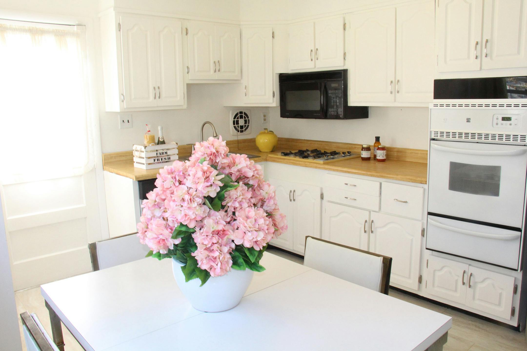 A new coat of paint gave this kitchen a refreshed look. Also consider upgrading appliances and flooring.