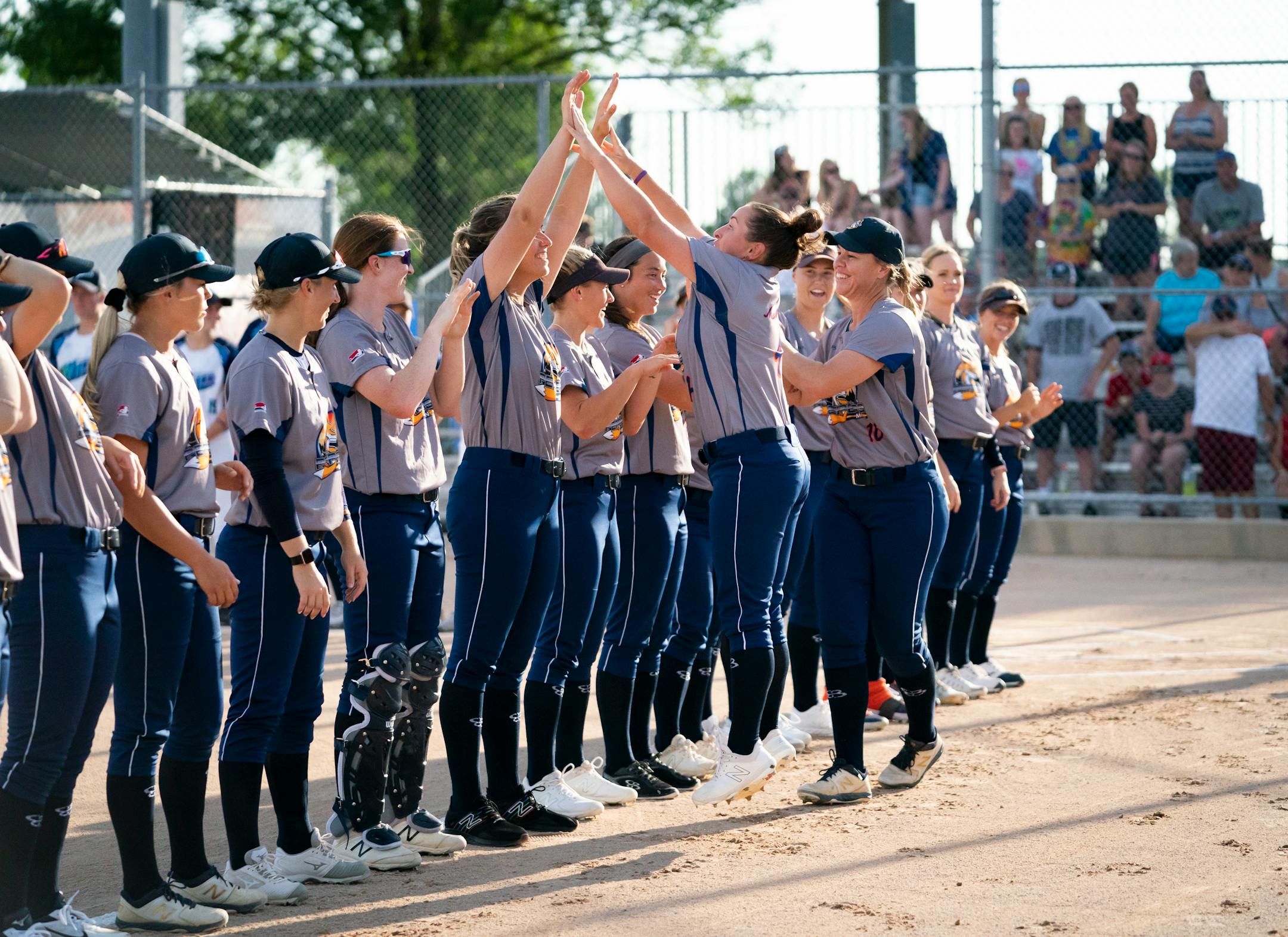 Aussie Peppers' Stacey McManus (4) jumped to give her teammate Amelia Cudicio (23) a high-five as the was announced before a game against the Canadian Wild in North Mankato, Minn. Wednesday, July 3, 2019. ] RENEE JONES SCHNEIDER ¥ renee.jones@startribune.com