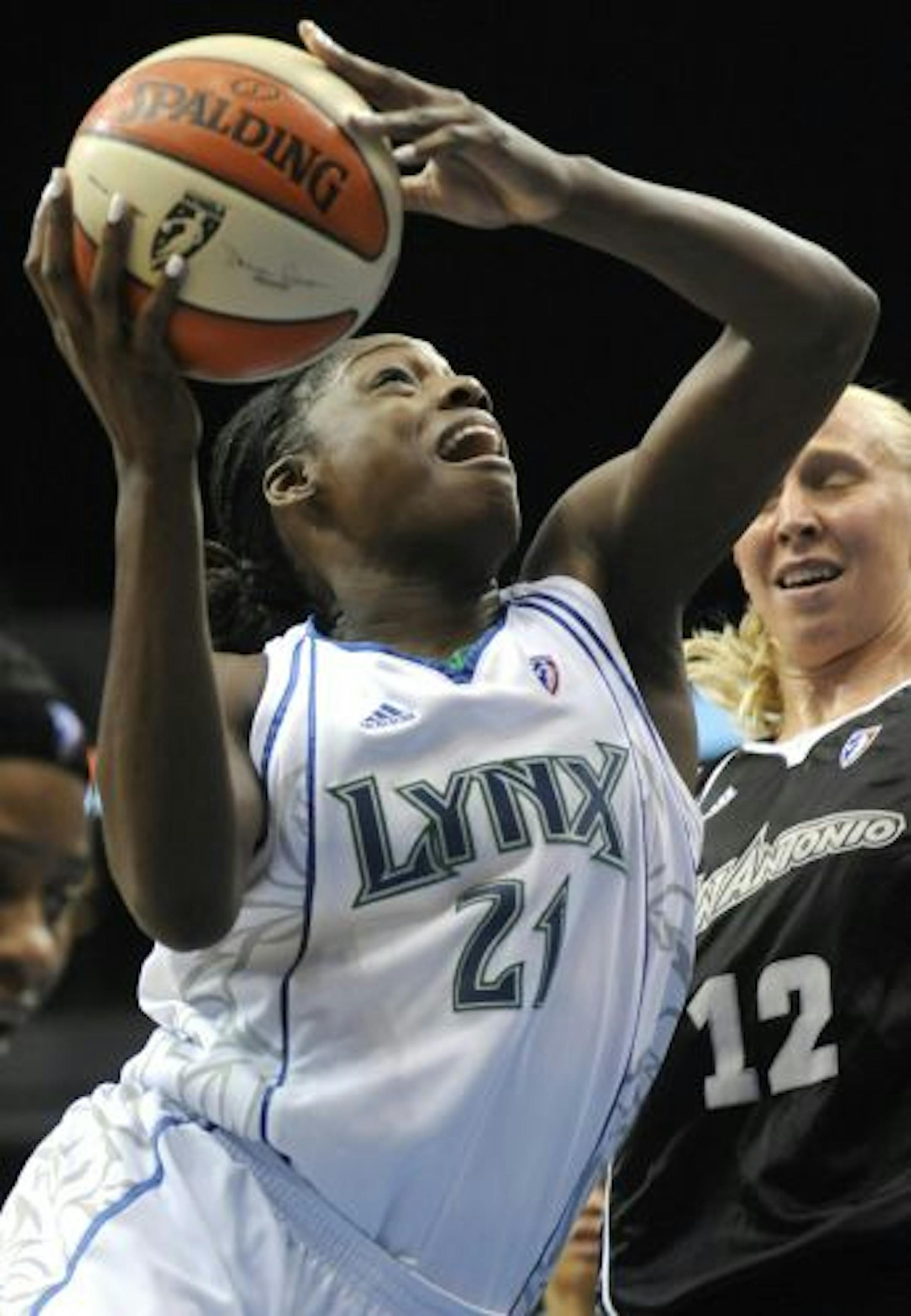 The Lynx's Nicky Anosike shot as San Antonio's Ann Wauters defended in the third quarter Sunday night at Target Center.