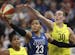 Minnesota Lynx forward Maya Moore (23) shot under the hoop while defended by Seattle Storm forward Breanna Stewart (30) in the second quarter.