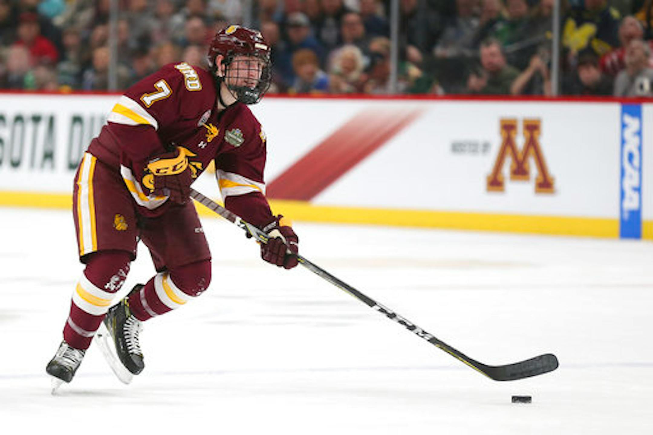 Minnesota Duluth's Scott Perunovich (7) controls the puck against Ohio State in the first period of the NCAA Frozen Four semifinal Thursday, April 5, 2018, in St. Paul, Minn. (AP Photo/Stacy Bengs)