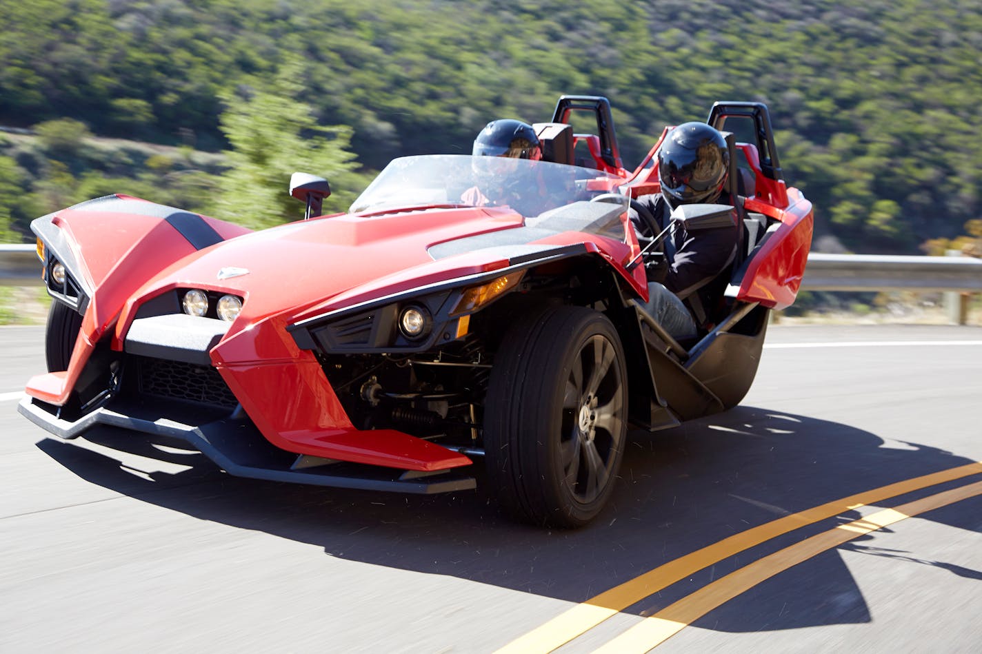 The Polaris Slingshot seats two riders side-by-side, which required a steering wheel instead of handlebars normally associated with motorcycles.